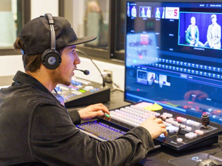 A student works in a recording studio in a CTE class